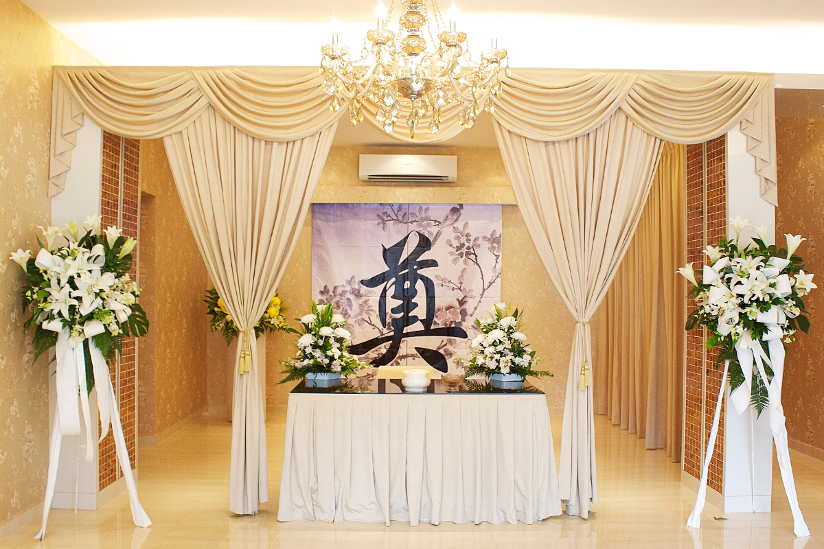 A peaceful and secure space adorned with flowers, designed for honouring the dearly departed